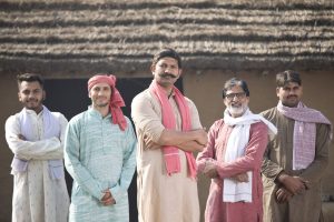 Group of happy Indian farmers posing together at village